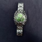 Green face y2k watch.