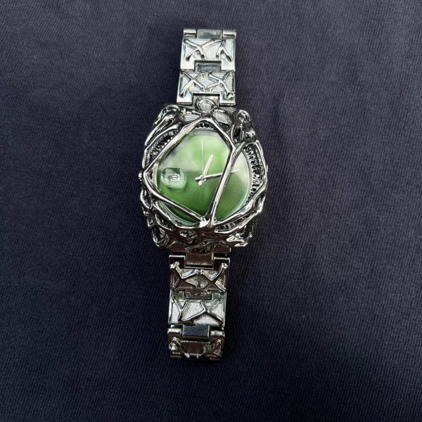 Green face y2k watch.